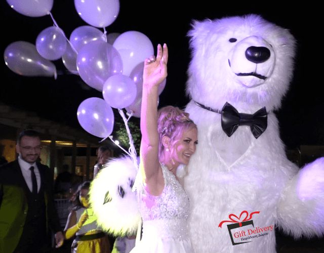 The White Polar Bear came to the wedding to deliver the gift to the bride and groom. Gift Delivery. Wedding gift. Surprise from the Political bear. White Polar Bear at the wedding.
